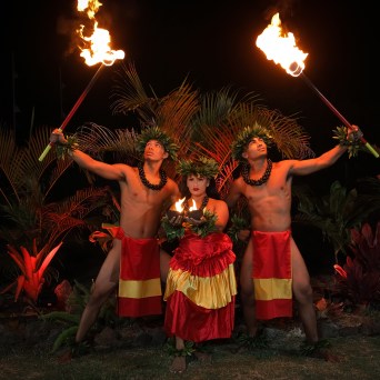 a person standing in front of a fire